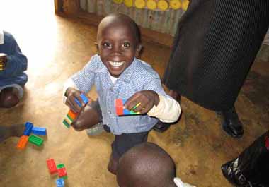 FKC child enjoying lego